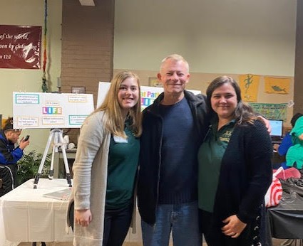 Students in the Jamestown Community College Occupational Therapy Assistant Program presented a Healthy Habits Wellness Fair at the Mental Health Association (MHA) earlier this month. The MHA enjoyed a Thanksgiving dinner at their November Recovery Luncheon and look forward to Giving Tuesday on December 3. Pictured at the Wellness Fair are, from left, Mikaela Gladding, Buddy Carlson, and Kelsey Eddy.