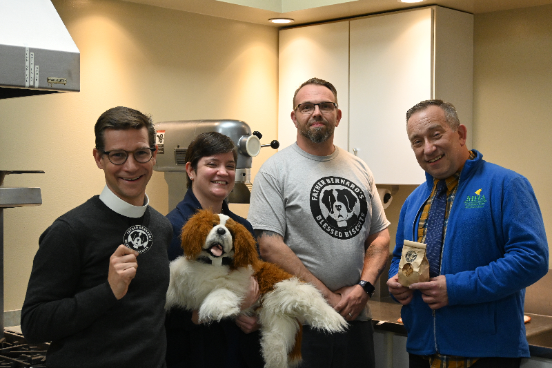 Father Bernard’s Blessed Biscuits was created by a partnership between Jamestown’s St. Luke’s Episcopal Church and the Mental Health Association in Chautauqua County. Key figures in the social enterprise are pictured in the kitchen in St. Luke’s Undercroft (from left): Fr. Luke Fodor, Nicole Gustafson, Sean Jones, and Steven Cobb.