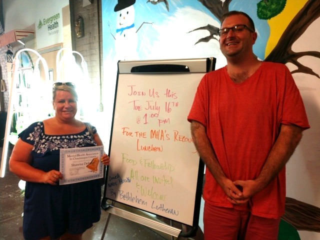 Participants in the July Recovery Luncheon included Shawna Dejesus, left, who received a certificate of recognition, and Dan Chadwick.