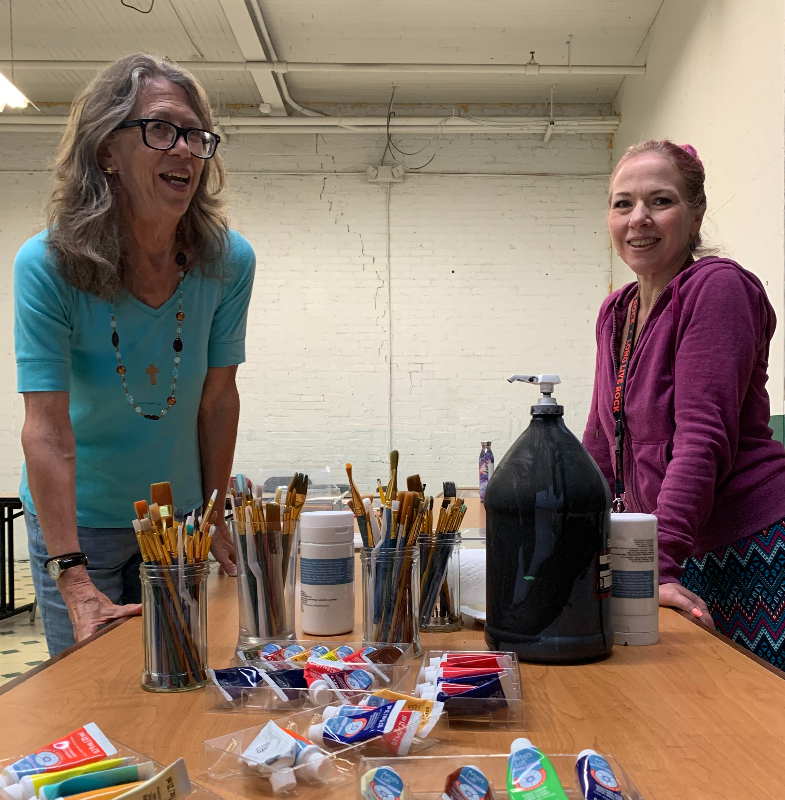 Local artists are invited to submit entries by August 15 for the “Art of Recovery” exhibit planned by St. Luke’s Episcopal Church and the Mental Health Association in Chautauqua County. Melita Lyon (left) and Carrie Clark look over art supplies as they prepare to create their works.