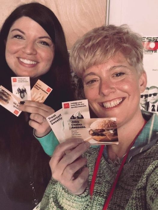 Mental Health Association Peer Recovery Coaches Liz Witherspoon (left) and Allison Murphy show the McDonald’s coupons you can choose from when you get the one-shot Johnson & Johnson COVID-19 vaccine this Wednesday, May 19, 10:30 a.m. to 4 p.m., at their location in the Gateway Center, Door 14, 31 Water Street. No appointment is necessary for anyone 16 and older.