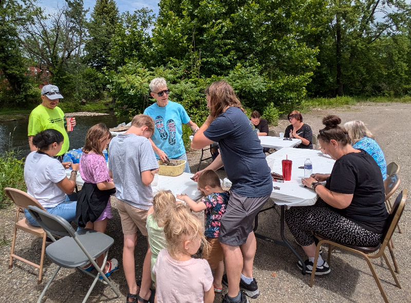 Artist Sara Baker Michalak (center) leads participants in making seed ball turtles at the conservation workshop held recently at the Mental Health Association. The event was co-sponsored by the Chautauqua Watershed Conservancy and the Roger Tory Peterson Institute.