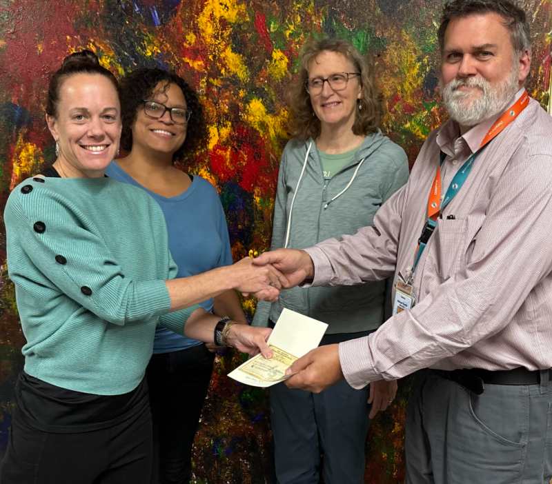 Proceeds from the summer’s 7th Annual Heron Trail Run 5K at the Heron Farm and Event Center were donated to the Mental Health Association in Chautauqua County. Pictured making the presentation to Executive Director Michael Nordin are, from left, Heron Volunteer Coordinator Jen Raines, Trail Run Race Director Faith Graham, and Heron owner Julie Rockcastle. Raines is also a longtime volunteer at the MHA, where she leads the Recovery Yoga group.